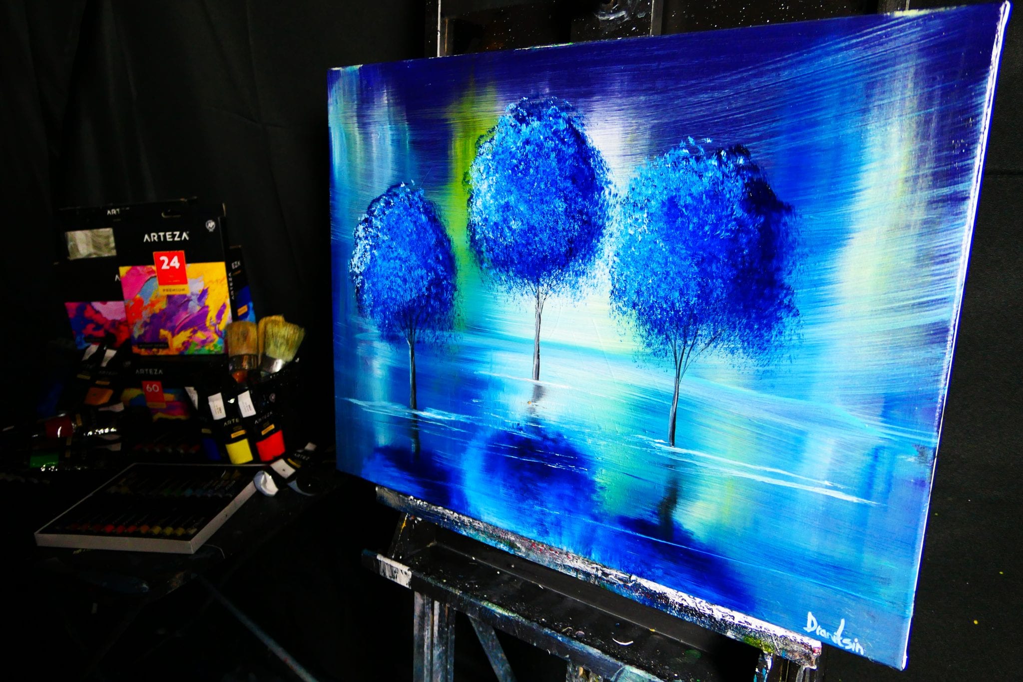 The Enchanting Allure of “SURREAL”: 3 Blue Trees Reflecting in a Mystical Landscape